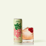 A can and glass of Raspberry Wild Leaf Hard Green Tea
