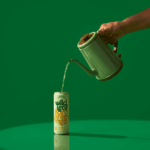 Tea being poured from a kettle into a can of Citrus Wild Leaf Hard Green Tea