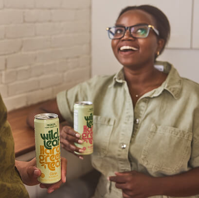 Two people enjoying Wild Leaf Hard Green Tea